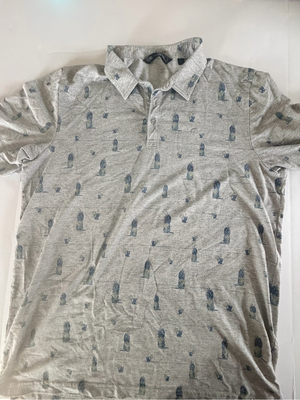 Travis Mathew Havana Nights light grey golf polo.